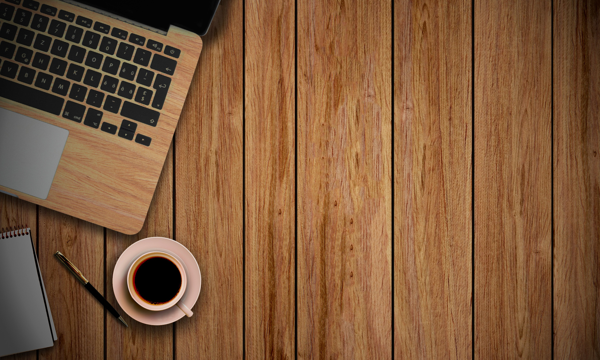 Top View of Laptop and Coffee on Wooden Background